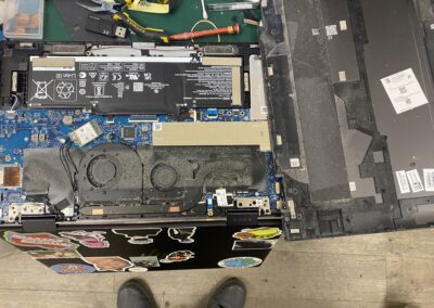 Laptop opened up to assess broken hinge damage - CPRepairs Lab